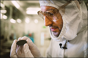 Technician Visually Inspecting a Gallium Wafer